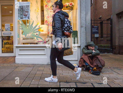 Preston, Lancashire. 1st March 2019. UK Weather. Cold, damp inclement day for Gary in the town centre as Preston’s homeless people hope for donations on the city centre streets. Trapped in the social system by having no fixed abode, they are unable to claim Universal Credit and resort to begging to hopefully acquire cash from passing shoppers, enough for a overnight hostel. Credit. MWI/AlamyLiveNews. Stock Photo