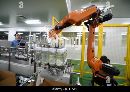 (190301) -- LANGFANG, March 1, 2019 (Xinhua) -- A staff of a Beijing-based honey maker tests equipment at a factory located in the Langfang Economic and Technological Development Zone in Langfang, north China's Hebei Province, March 1, 2019. The Langfang Economic and Technological Development Zone has seized the opportunities that come with the Beijing-Tianjin-Hebei coordinated development strategy in recent years, optimizing its industrial distribution by upgrading and transforming the old industries. Taking advantage of its location between Beijing and Tianjin, the development zone has gaine Stock Photo