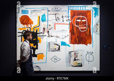 London, UK.  1 March 2019. A technician reviews ''Apex'' by Jean-Michel Basquiat, (Est. £5-7m). Preview of Sotheby's Contemporary Art Sale in their New Bond Street galleries.  Works by artists including Tracey Emin, Jenny Saville, Jean-Michel Basquiat and Andy Warhol will be offered for auction on 5 March 2019.   Credit: Stephen Chung / Alamy Live News Stock Photo