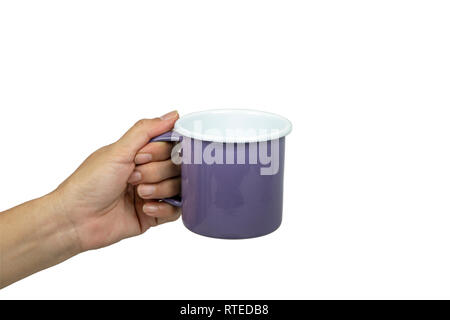 Female hands holding violet tin cup on white background. Stock Photo