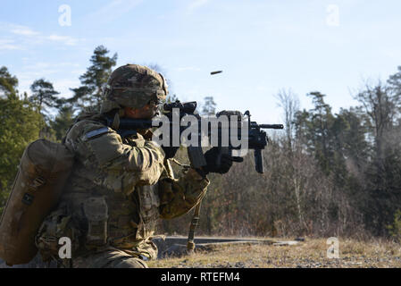 A U.S. Soldier assigned to 2nd Battalion, 503rd Infantry Regiment, 173rd Airborne Brigade, fires an M4 rifle during a squad live fire exercise at the 7th Army Training Command’s Grafenwoehr Training Area, Grafenwoehr, Germany, Feb. 26, 2019. (U.S. Army photo by Pfc. Denice Lopez)