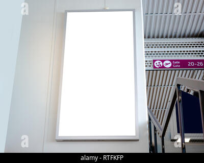 White blank empty signboard, billboard, mock-up at the airport terminal, gate, mock up of poster, media template ads display for any promotions. Stock Photo
