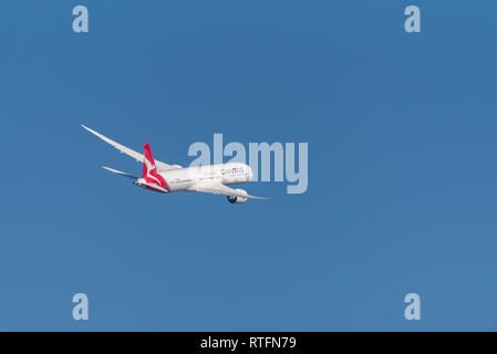 QANTAS Boeing 787 Dreamliner jet airliner plane VH-ZNE taking off from London Heathrow Airport, UK, in blue sky. Flight departure Stock Photo
