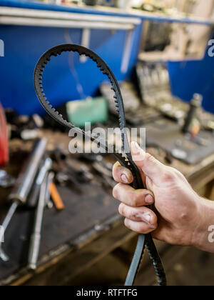 Old pulley and belt of a car alternator Stock Photo - Alamy