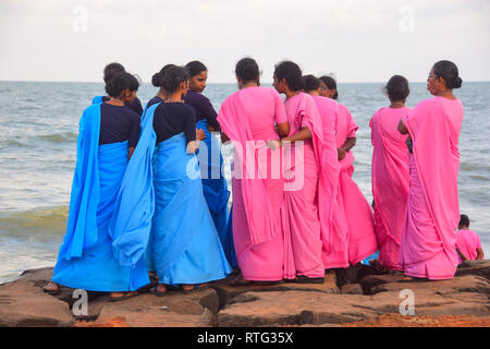 Indian Ladies on sea front in Pink and blue sarees, Pondicherry, Puducherry, Tamil Nadu, India Stock Photo