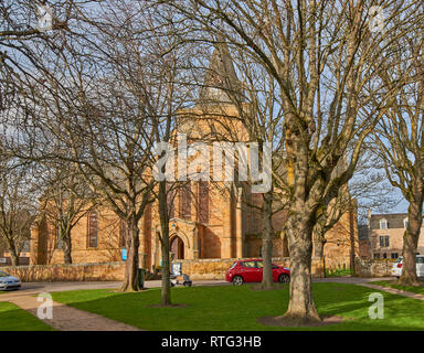 DORNOCH SUTHERLAND SCOTLAND THE CATHEDRAL SURROUNDED BY TREES IN WINTER Stock Photo