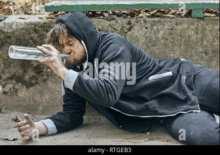 Drunk young people. (alcoholism, pain, pity, hopelessness, social problem of dependence concept) Stock Photo