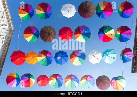 Colorful decoration with umbrellas against clear blue sky in Chioggia Stock Photo