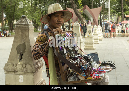 Man selling fake luxury sunglasses in Cambodia Stock Photo