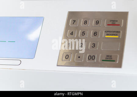 ATM keyboard on cash machine in selective focus. Stock Photo