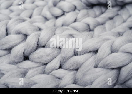 Gray knitted blanket from merino wool closeup Stock Photo