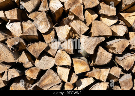 Stacked firewood during winter time for household use in Lower Austria Stock Photo