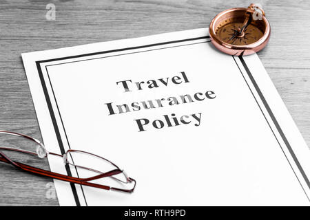 Travel Insurance Policy on Table. Business Concept Stock Photo