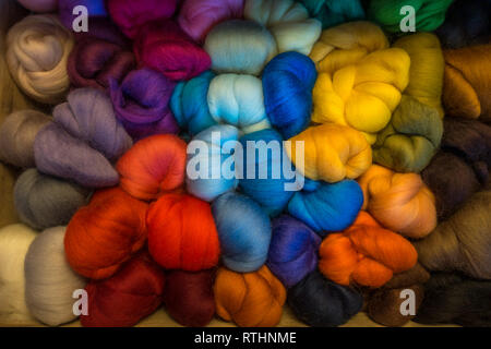 Craft drawer full of brightly coloured merino wool tops for needle felting Stock Photo