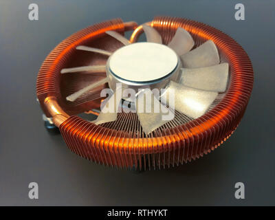 CPU cooler with copper plates on a gray background Stock Photo