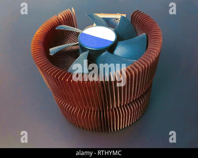 CPU cooler with copper plates on a gray background Stock Photo