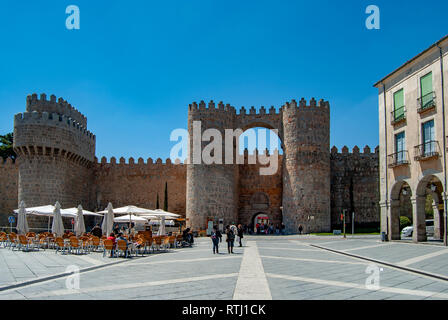 Avila, Spain; May 2013: Mighty medieval wall and towers surrounding the old town of Avila, Spain Stock Photo