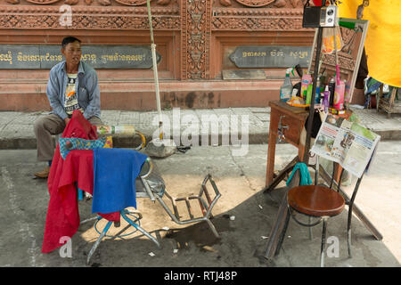 Street barber shop in Phnom Penh, Cambodia Stock Photo