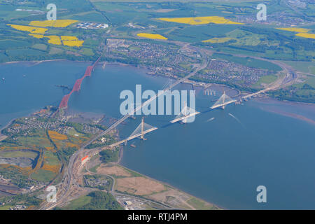 Aerial view of the Queensferry Crossing bridge during construction with Forth Rail Bridge and Forth Road Bridge, Queensferry, Edinburgh, Scotland, UK