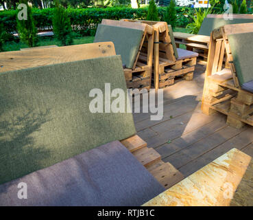 Benches in a cafe on the street from the old pallets Stock Photo