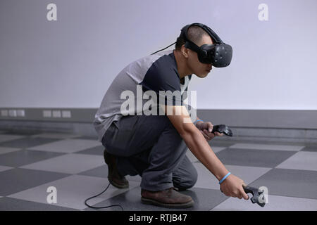 Men steps into virtual reality world with virtual glasses eyewear htc vive Stock Photo