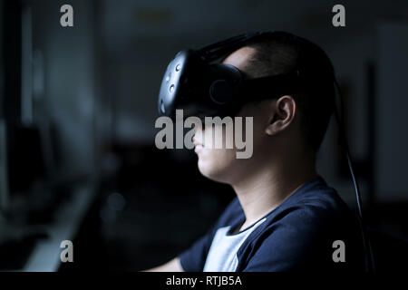 Men steps into virtual reality world with virtual glasses eyewear htc vive Stock Photo