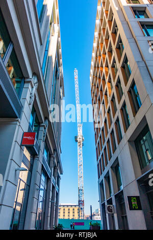 White construction crane working on the new Google UK HQ seen here between 2 and 3 Pancras Square, Kings Cross, London Stock Photo