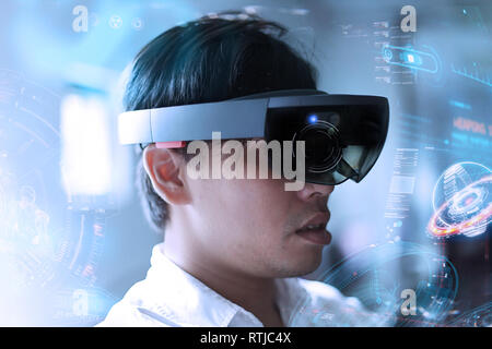 Business Men steps into virtual reality world with microsoft hololens 1 Stock Photo