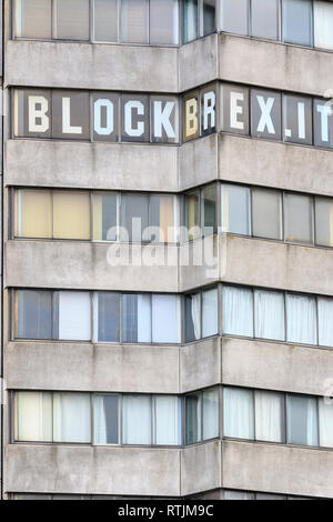Block Brexit sign large letters in the windows of the 1964 Brutalism architectural style Arlington House tower block on Margate seafront. Stock Photo