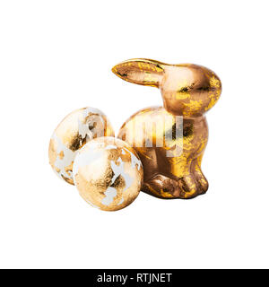 Golden rabbit figure and eggs decorated with golden foil isolated on white background. Design element. Stock Photo