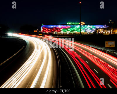 Augsburg, Germany- February 16 2019: View on WWK Arena the soccer stadion of FC Augsburg from highway bridge. Night image with long exposure. Stock Photo