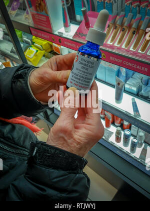 A woman holds a bottle of First Aid Beauty brand 'Ultra Repair Cannabis and Oat Dry Oil' in a health and beauty supply store in New York on Sunday, February 24, 2019. The produce contains Cannabis Sativa Seed Oil from hemp and is part of the growing trend of infusing products with hemp and CBD related ingredients. (Â© Richard B. Levine) Stock Photo