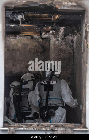 Nuremberg, Germany. 02 March 2019, Bavaria, Nürnberg: Forensic technicians of the police in respiratory protective clothing examine a room in the burnt out house. Five people died in a fire in a detached house in Nuremberg. Photo: Lino Mirgeler/dpa Credit: dpa picture alliance/Alamy Live News Stock Photo