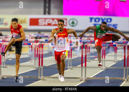 Glasgow, Scotland, UK. 2nd March, 2019. Orlando Ortega, representing Spain finishing at the men's 60 metre hurdles race at the European Athletics indoor championships, Glasgow, UK. He is pursued by Brahian Pena of Switzerland and Rasul Dabo of Portugal Credit: Findlay/Alamy Live News Stock Photo