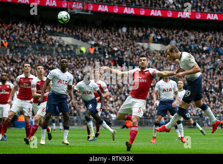 London, UK. 2nd Mar, 2019. Tottenham Hotspur's Harry Kane (1st R) competes during the Premier League match between Tottenham Hotspur and Arsenal in London, Britain on March 2, 2019. FOR EDITORIAL USE ONLY. NOT FOR SALE FOR MARKETING OR ADVERTISING CAMPAIGNS. NO USE WITH UNAUTHORIZED AUDIO, VIDEO, DATA, FIXTURE LISTS, CLUB/LEAGUE LOGOS OR 'LIVE' SERVICES. ONLINE IN-MATCH USE LIMITED TO 45 IMAGES, NO VIDEO EMULATION. NO USE IN BETTING, GAMES OR SINGLE CLUB/LEAGUE/PLAYER PUBLICATIONS. Credit: Han Yan/Xinhua/Alamy Live News Stock Photo