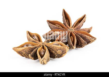 Group of two whole dry brown star anise fruit one is like a butterfly isolated on white background Stock Photo