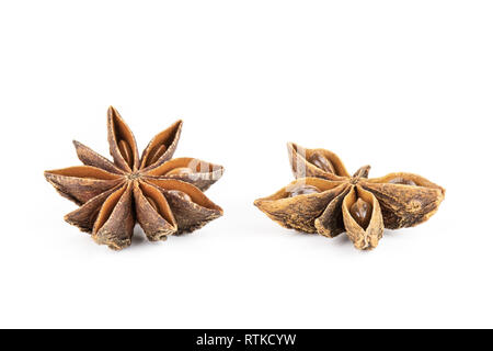 Group of two whole dry brown star anise fruit one is like a butterfly isolated on white background Stock Photo