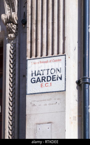 Painted street name sign at Hatton Garden, London Borough of Camden ...