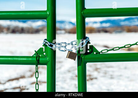 Ranch gate locked with padlock & chain; central Colorado; USA Stock Photo