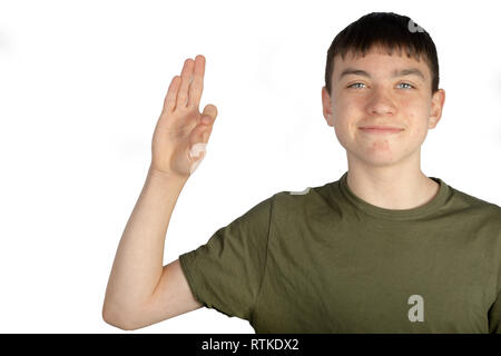 Caucasian teenage boy doing American Sign Language on one hand showing the symbol for F Stock Photo