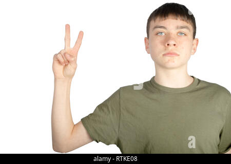 Caucasian teenage boy doing American Sign Language on one hand showing the symbol for V Stock Photo