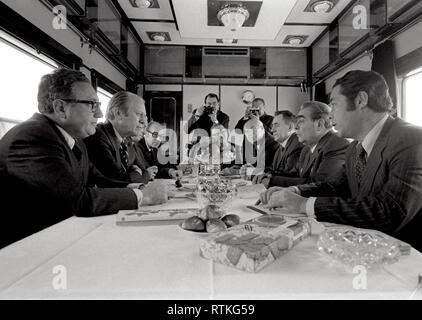 1974, November 23 – Soviet Train – Union of Soviet Socialist Republics – Gerald R. Ford, Henry Kissinger, Helmut Sonnenfeldt, Ambassador Walter J. Stoessel, Leonid Brezhnev, Andrei Gromyko, Ambassador Anatoly Dobrynin, Victor Sukhrodev; Others in the American and Soviet Contingents – seated around table, talking – Trip to the Union of Soviet Socialist Republics (U.S.S.R.) – Meeting During Train Ride to Vladivostok - (Local Time); Stoessel (US Ambassador to the U.S.S.R.); Brezhnev (General Secretary of the U.S.S.R.); Gromyko (Foreign Minister of the U.S.S.R.); Dobrynin (U.S.S.R. Ambassador to t Stock Photo