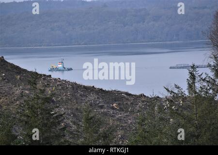 Floating fish cages of HDPE Pipes Under Tow in Loch Creran, Stock Photo