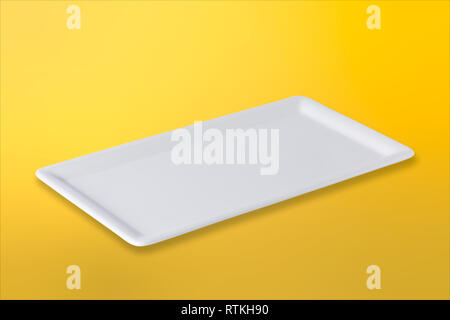 Empty white cornered plate on gradient yellow orange background, front view, oblique position Stock Photo