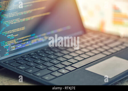 Closeup coding, programming on laptop screen, web development, developer Stock Photo