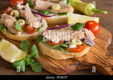 Tuna sandwiches on wooden board Stock Photo