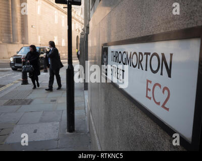 Throgmorton street sign, City of London, London UK, with city workers in background Stock Photo