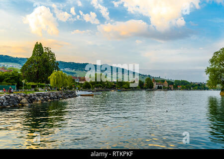 Sunset with reflections on beautiful Geneva lake, Switzerland. Stock Photo