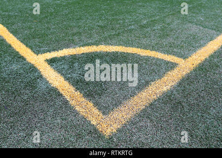 Soccer corner sideline, yellow lines on green artificial turf Stock Photo