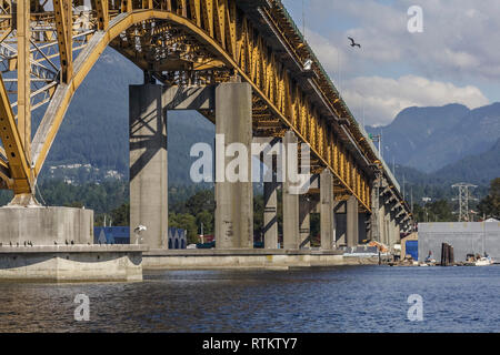 Water level view of underside of Ironworkers Memorial Bridge which spans Burrard Inlet at Second Narrows, connecting Vancouver and the North Shore. Stock Photo
